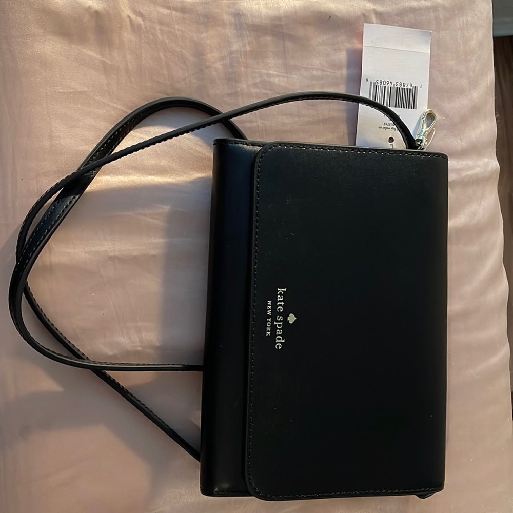 Kate Spade Kerri wallet with shoulder strap.